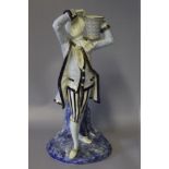 A ROYAL WORCESTER FIGURAL CANDLESTICK, modelled as a classical gentleman in period dress holding a