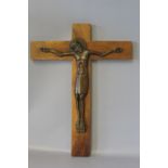 A BRONZE CORPUS CHRISTI, mounted on wooden cross, monogrammed, H 30.25 cm
