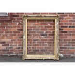 A 19TH CENTURY GOLD SWEPT FRAME WITH INTEGRAL SLIP A/F, frame W 10 cm, rebate approx 113 x 87 cm