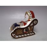 A ROYAL CROWN DERBY SANTA AND SLEIGH CHRISTMAS PAPERWEIGHT, silver stopper, with associated box, L