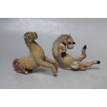 TWO UNUSUAL MINIATURE CRACKLE GLAZE TANG HORSES, one modelled seated with hooves flailing, the other