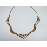 A 9CT GOLD HALF COLLARETTE STYLE NECKLACE, the alternating solid and reticulated panels individually