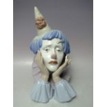 A LLADRO BUST OF A CLOWN, head in hands, H 30 cm