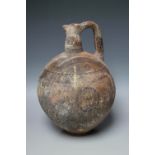 A CYPRIOT BLACK ON RED WARE TERRACOTTA JUG - CYPRO-ARCHAIC - CIRCA 750-600 BC, the globular body