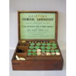 A 19TH CENTURY MAHOGANY CASED CHEMISTS SET, the hinged lid opening to reveal fitted contents, the