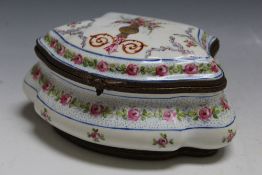 A SEVRES / LIMOGES STYLE CERAMIC TRINKET, of bombe form, white ground with floral embellishment,