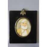 (XIX-XX). Indian school, oval portrait miniature on ivory, study of a bearded man, unsigned,