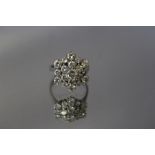 AN 18CT GOLD DIAMOND CLUSTER RING, estimated 1.6 carats in total