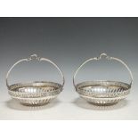 A PAIR OF WMF CIRCULAR SILVER PLATED BASKETS, with openwork and Greek key design border, basket