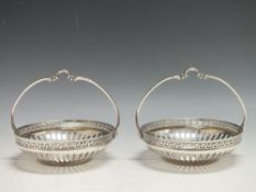 A PAIR OF WMF CIRCULAR SILVER PLATED BASKETS, with openwork and Greek key design border, basket