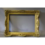 A 19TH CENTURY GOLD SWEPT FRAME, frame W 8 cm, rebate 50 x 35 cm