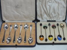 A CASED SET OF SIX ART DECO COFFEE BEAN SPOONS WITH ENAMEL DECORATION, unmarked gilt metal, together