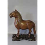 A JAPANESE STYLE HARDWOOD CARVING OF A HORSE ON STAND, a/f, W 19 cmCondition Report:tail restored