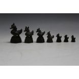 A GRADUATED SET OF SEVEN ORIENTAL CAST BRONZE OPIUM WEIGHTS IN THE FORM OF DUCKS, tallest 5.5 cm