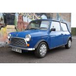 A 1996 BLUE ROVER MINI SPRITE N482 XOE, 1275cc petrol, three door saloon car, log book states