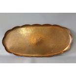 NEWLYN. Oval copper tray with scalloped edges, stamped verso, 27 x 58 cm