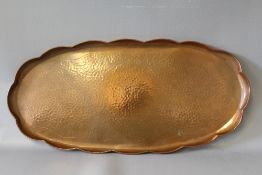 NEWLYN. Oval copper tray with scalloped edges, stamped verso, 27 x 58 cm