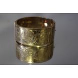 A HALLMARKED 9 CT GOLD WIDE BANGLE, approx weight 47.5g, W 2.75 cm