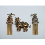 AN UNUSUAL HALLMARKED 9CT GOLD PANTOMIME HORSE ARTICULATED CHARM, approx 4.4 g, together with a pair