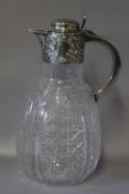 A HALLMARKED SILVER TOPPED CUT GLASS CLARET JUG - SHEFFIELD 1897, H 23 cm