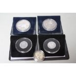 A COLLECTION OF FIVE ASSORTED COMMEMORATIVE COINS TO INCLUDE SILVER EXAMPLES, comprising a 2000