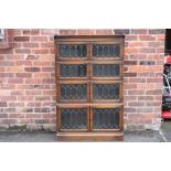 A 20TH CENTURY OAK GLAZED 'MINTY' FOUR STAGE BOOKCASE, H 142 cm, W 90 cm