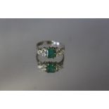 AN 18 CT WHITE GOLD EMERALD AND DIAMOND RING, ring size N