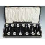 A CASED SET OF TWELVE ART DECO HALLMARKED SILVER COFFEE BEAN SPOONS - BIRMINGHAM 1931