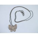 A SMALL MODERN BUTTERFLY PENDANT SET WITH CZ STONES, white metal stamped 585 and on a similar chain