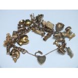 A HALLMARKED 9 CT GOLD CHARM BRACELET, approx weight 79.2g