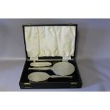 A CASED HALLMARKED SILVER DRESSING TABLE SET - BIRMINGHAM 1963, W 32 cm