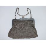 A LADIES SILVER AND MESH LINK PURSE, the frame stamped .925 with makers mark for H & Co., carry