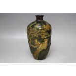 AN UNUSUAL ORIENTAL BRONZED BALUSTER VASE, decorated in gilt relief with mythical birds amongst
