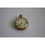 AN 18ct GOLD OPEN FACE TOP WIND POCKET WATCH, white enamel dial with black Roman Numeral markings,
