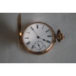 A 9ct GOLD GENTLEMAN'S FULL HUNTER POCKET WATCH (Unsigned) with white enamel dial, with black