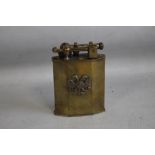 AN ANTIQUE FRENCH MINISTRE FINANCES BRASS LIFT ARM TABLE LIGHTER, with double headed eagle badge