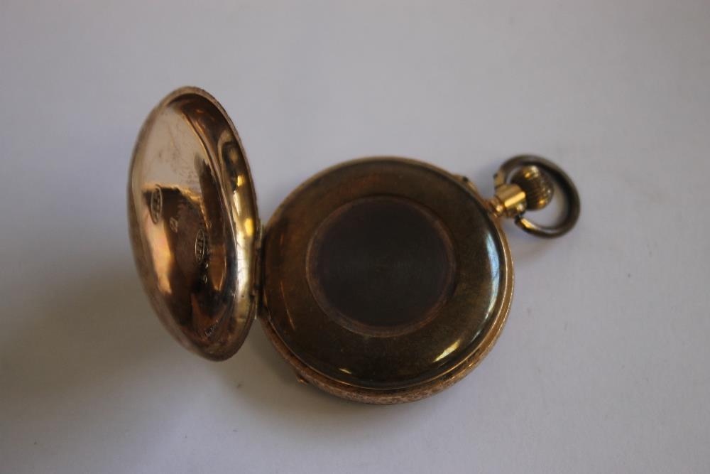 A LATE 19TH CENTURY CONTINENTAL LADIES' FOB WATCH MARKED 14ct, gilt engraved dial with black Roman - Image 6 of 6