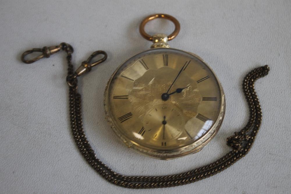 A YELLOW METAL GENTLEMAN'S OPEN FACE KEY WIND POCKET WATCH, gilt dial engraved with a scene of