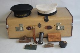 A VINTAGE SUITCASE CONTAINING TWO BRITISH ROYAL NAVY CAPS, (One with ribbon for HMS Osprey), along
