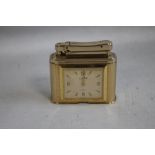 A VINTAGE COLIBRI TABLE LIGHTER, with an eight day clock inset A/F