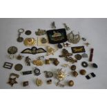 A BOX OF MILITARY BADGES AND BUTTONS, to include cap badges and cloth badges
