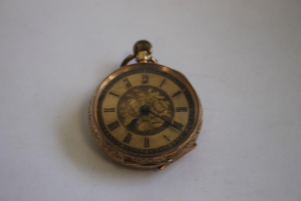 A LATE 19TH CENTURY CONTINENTAL LADIES' FOB WATCH MARKED 14ct, gilt engraved dial with black Roman - Image 4 of 6