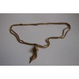A 9ct GOLD TRIPLE STRAND ROPE NECKLACE, with knot finial.