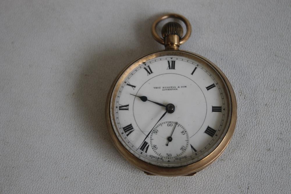 A 9ct GOLD OPEN FACE TOP WIND POCKET WATCH, white enamel dial signed 'Thos Russell and Son