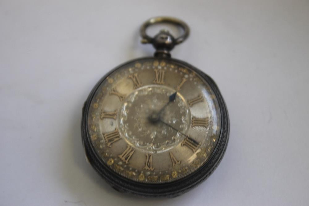 A LATE 19TH CENTURY CONTINENTAL LADIES' FOB WATCH MARKED 14ct, gilt engraved dial with black Roman - Image 2 of 6