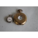 A CONTINENTAL GILT METAL ENAMELLED LADIES FOB WATCH, with pearl set bezel and borders along with a