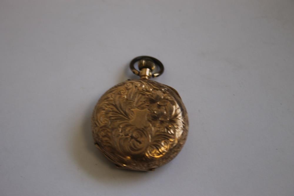 A LATE 19TH CENTURY CONTINENTAL LADIES' FOB WATCH MARKED 14ct, gilt engraved dial with black Roman - Image 5 of 6