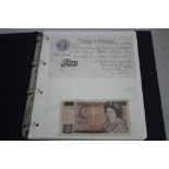 AN ALBUM OF BRITISH BANKNOTES 10/- - £10, some include military issues, along with a group of 19th/