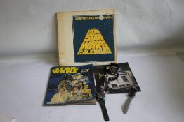 STAR WARS 1978 CALENDAR IN ORIGINAL CARD PACK, together with a scrap book, a R2D2 wrist watch, a