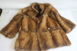 A VINTAGE LADIES' FUR COAT